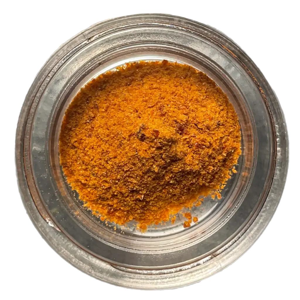 jar of orange colored cordyceps crystals