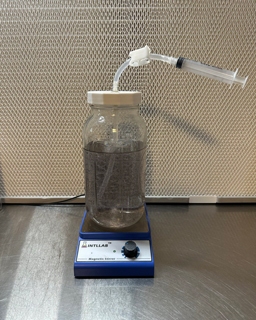 Jar of spore solution on a stir plate